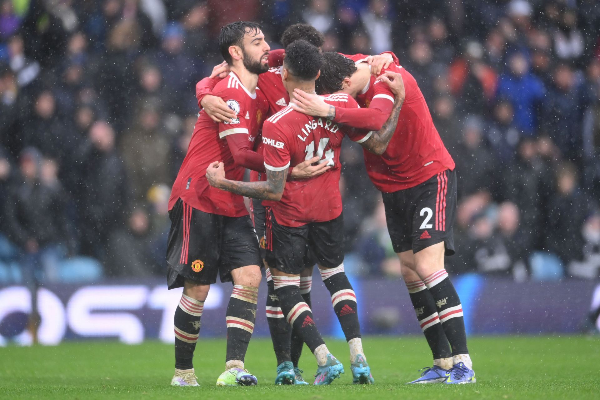 Manchester United players celebrate during their win against Leeds United.