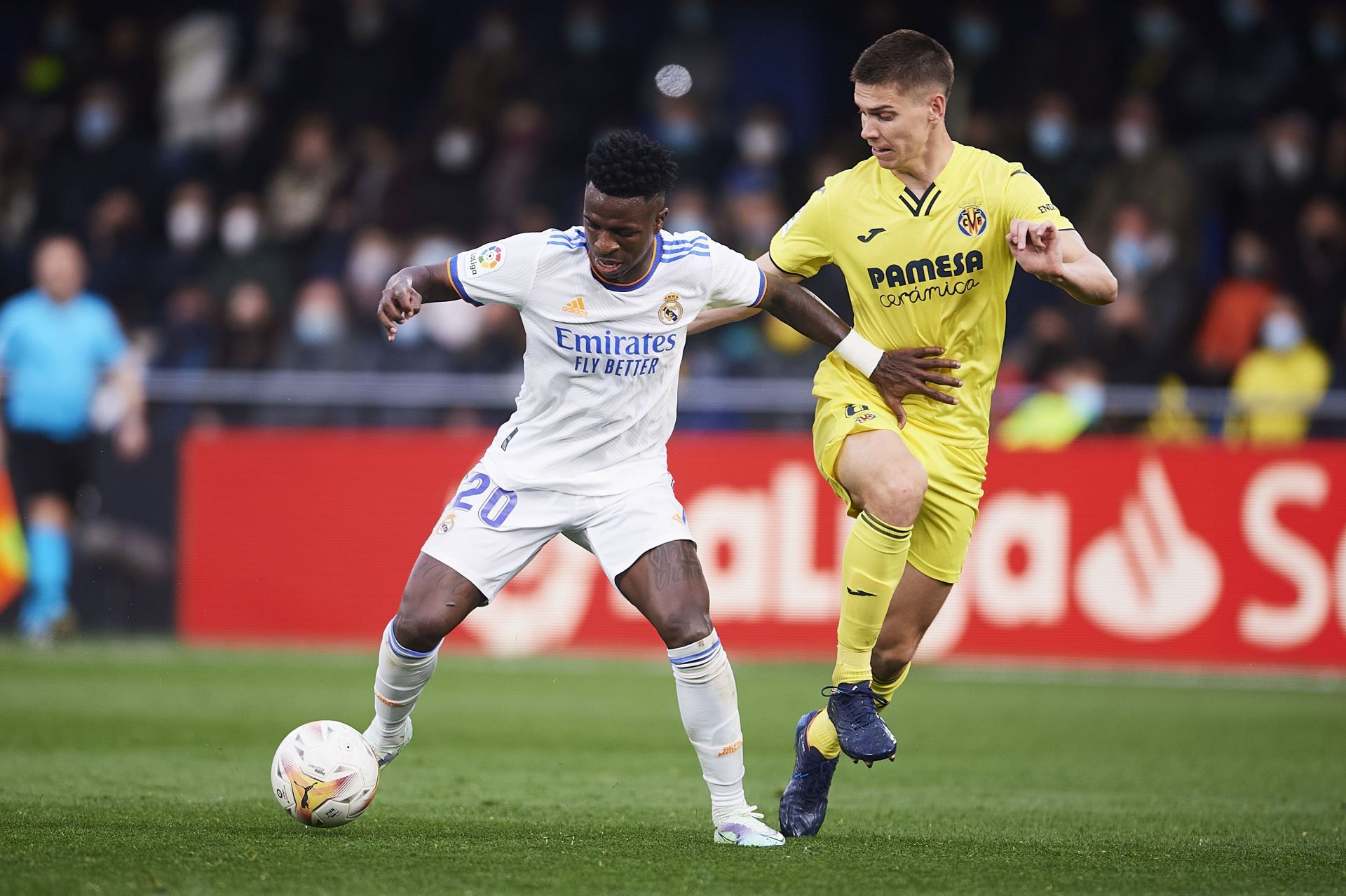 Vinicius Jr tussles it out against Juan Foyth.