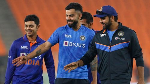 Virat Kohli (C) and Rohit Sharma (R) share a light moment off the field.