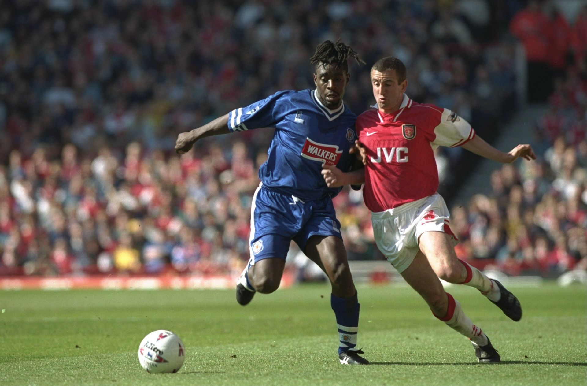 Jamie Lawrence and Nigel Winterburn battle for possession