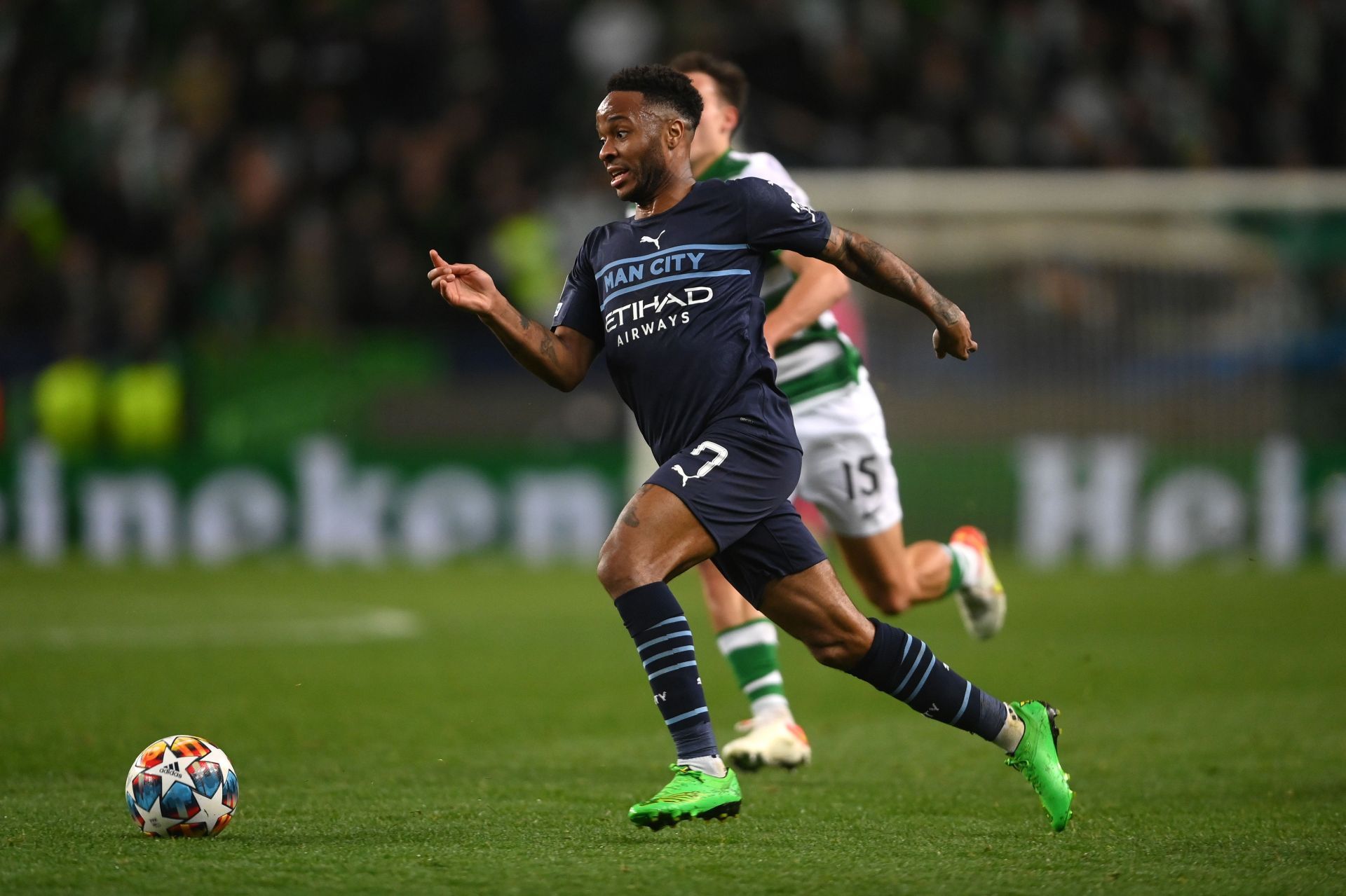 Raheem Sterling races past a Sporting Lisbon defender