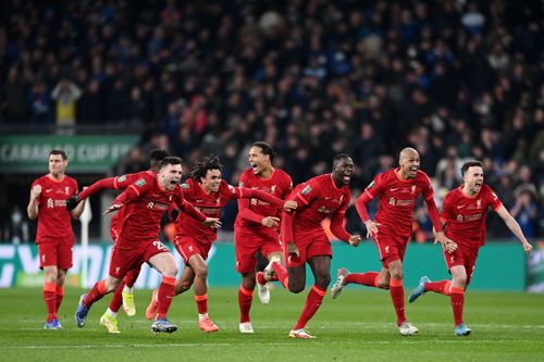 Liverpool players jubilant after winning the penalty shootout in the League Cup final against Chelsea