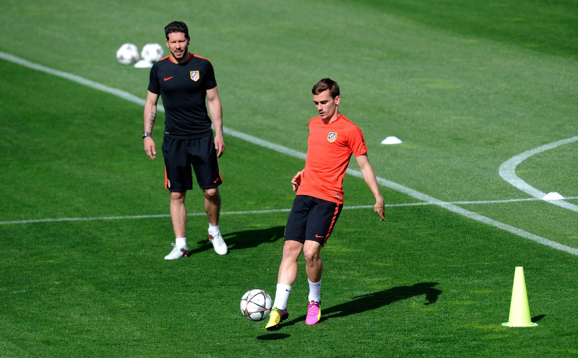 Antoine Griezmann (right) has scored almost 150 goals under Simeone.