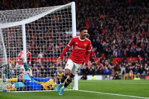 Jadon Sancho celebrates after scoring a goal.