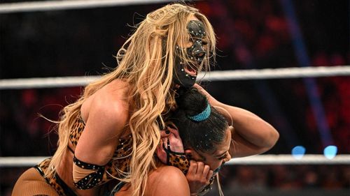 Carmella competing on WWE RAW wearing her protective mask