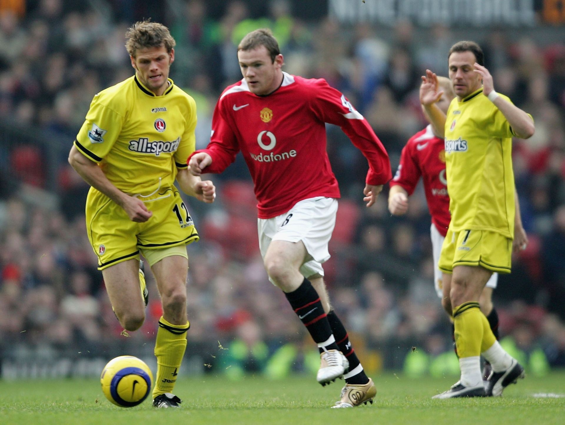 Wayne Rooney (centre) in action for Manchester United