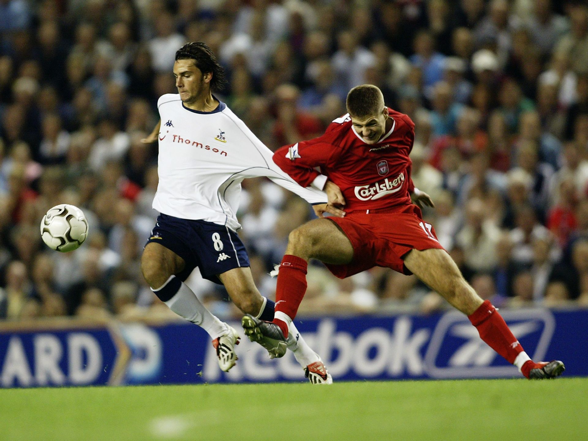 Postiga (left) of Spurs being held by Steven Gerrard of Liverpool