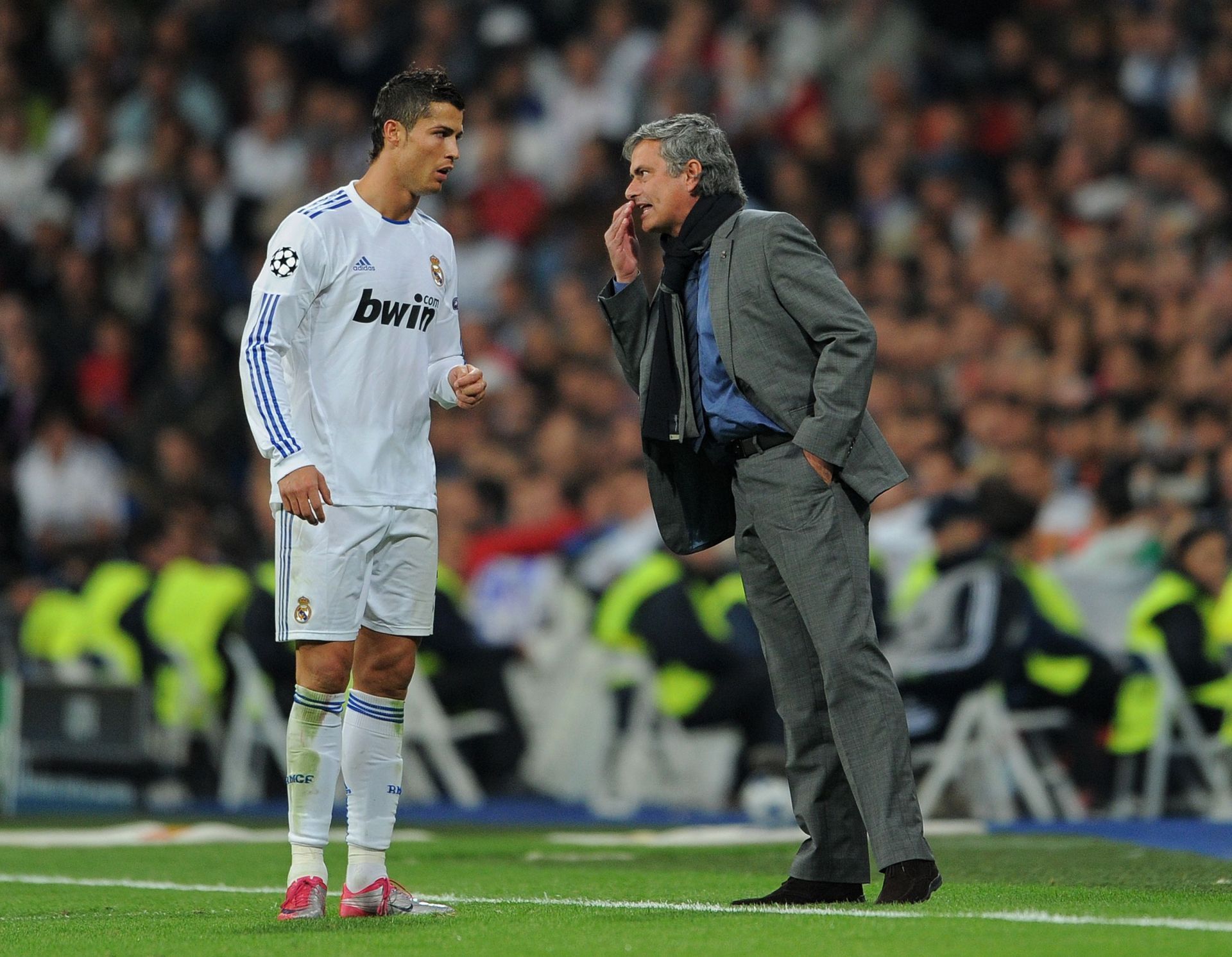 Cristiano Ronaldo (L) and Jose Mourinho in discussion at the Bernabeu.