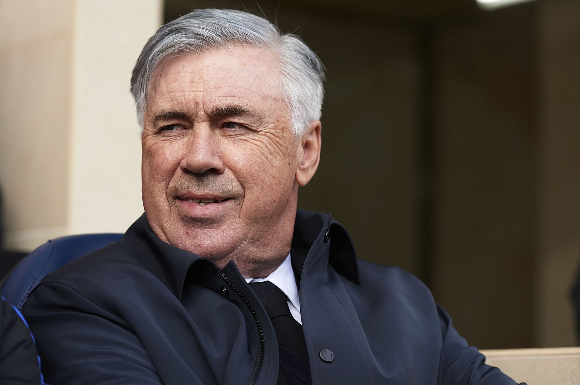 Carlo Ancelotti looks on.