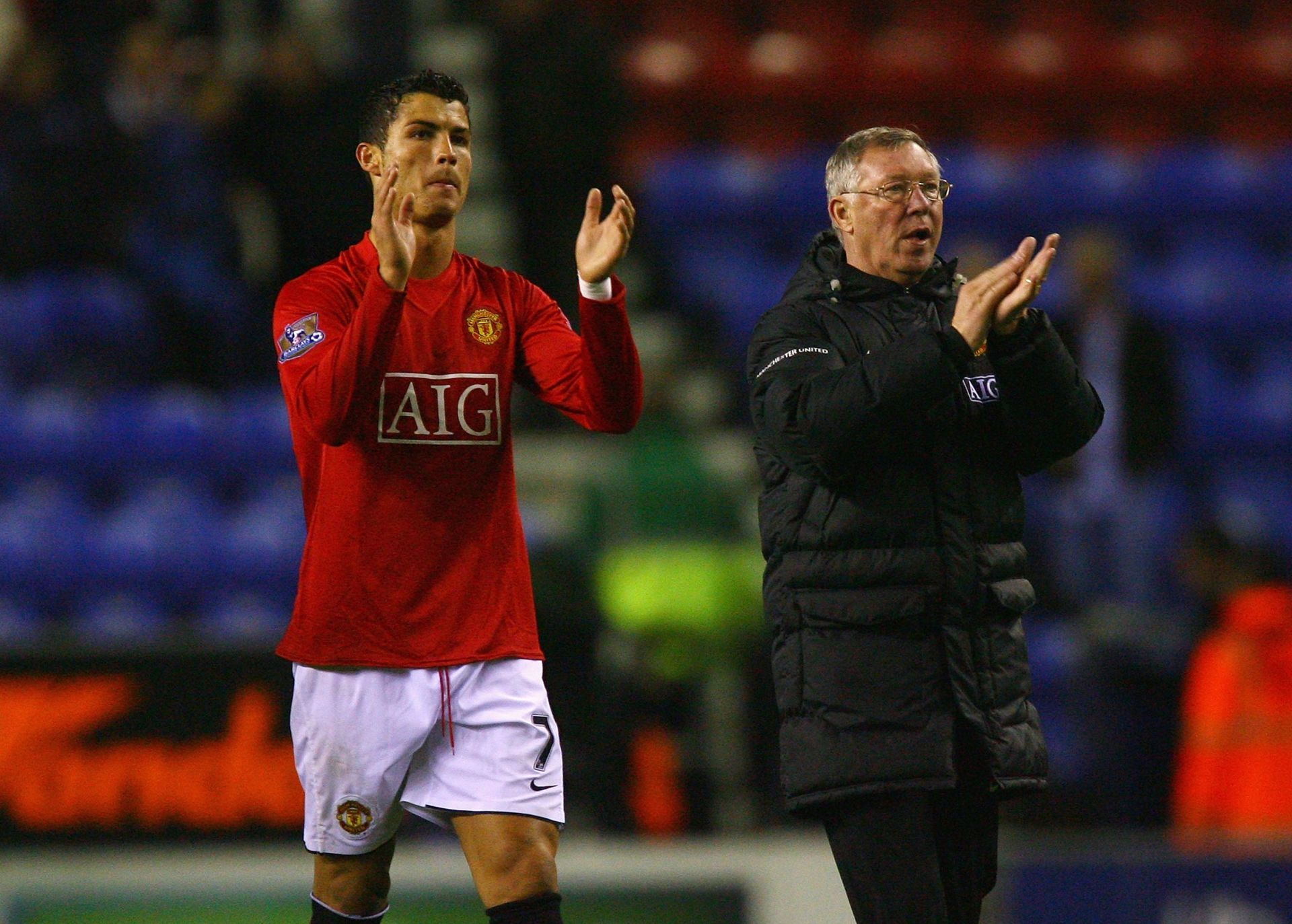 Cristiano Ronaldo and Sir Alex Ferguson applaud the fans.