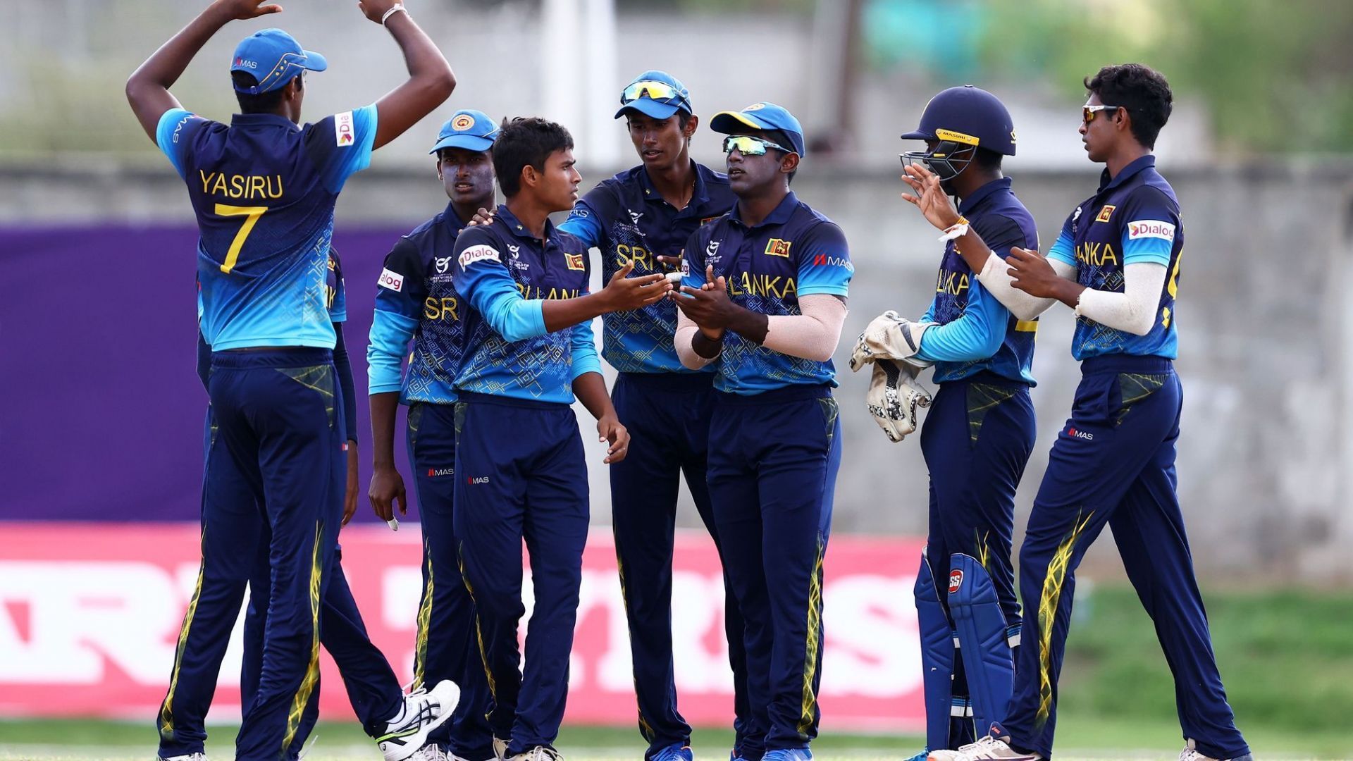 Dunith Wellalage celebrates after taking a wicket