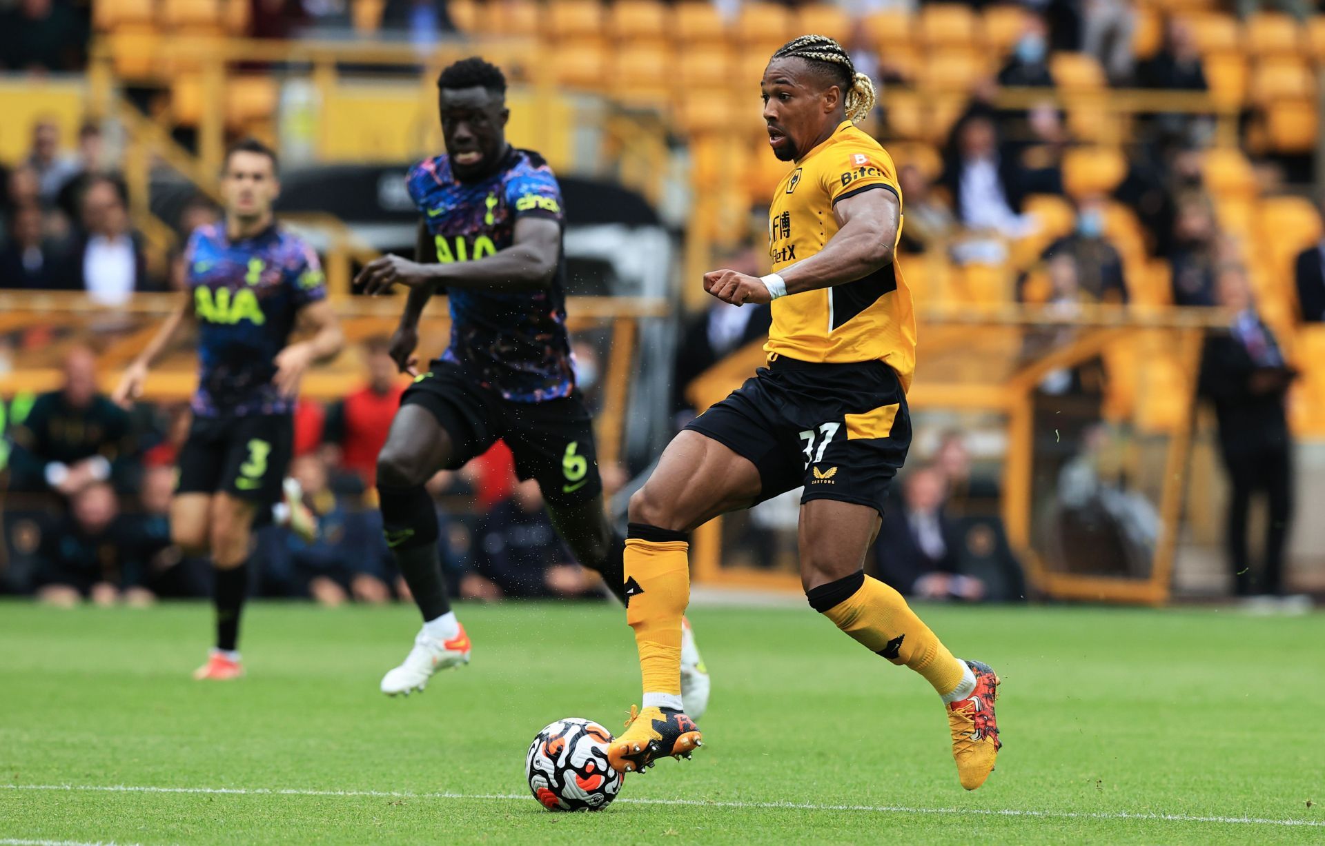 Adama Traore drives forward against Tottenham Hotspur.