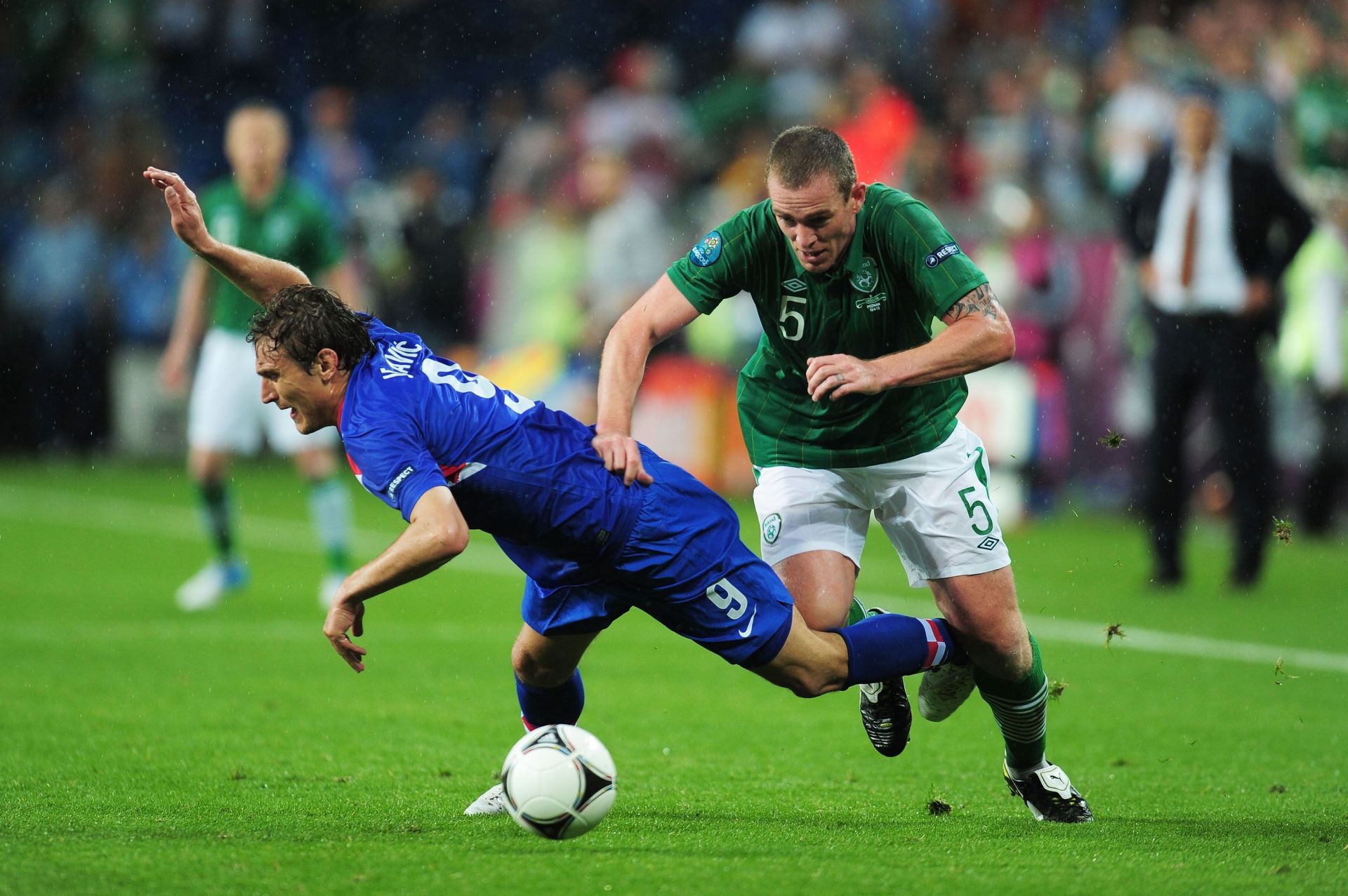 Dunne (right) clashing with a Croatian player at the UEFA EURO 2012