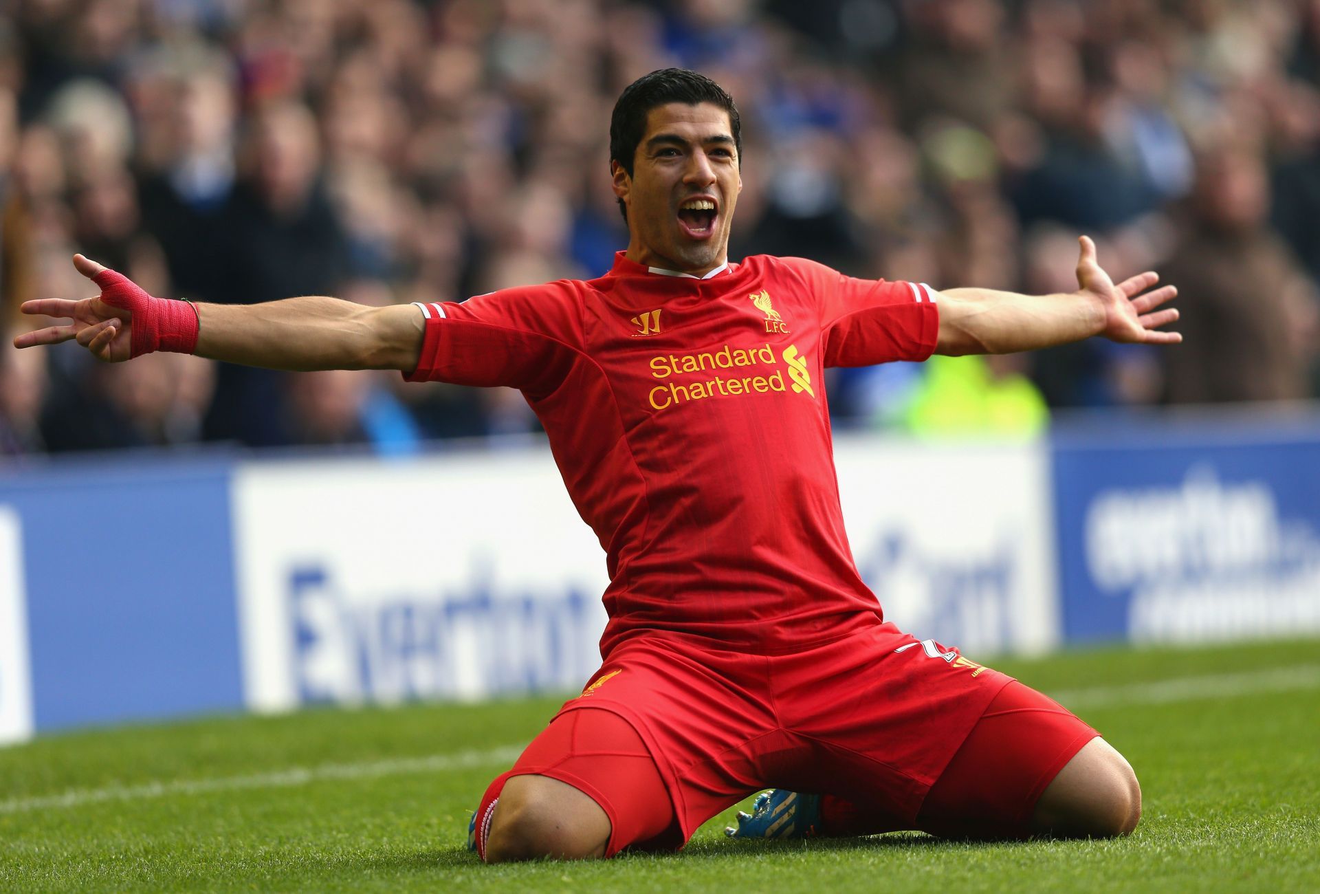 Suarez jubilates after scoring against Everton