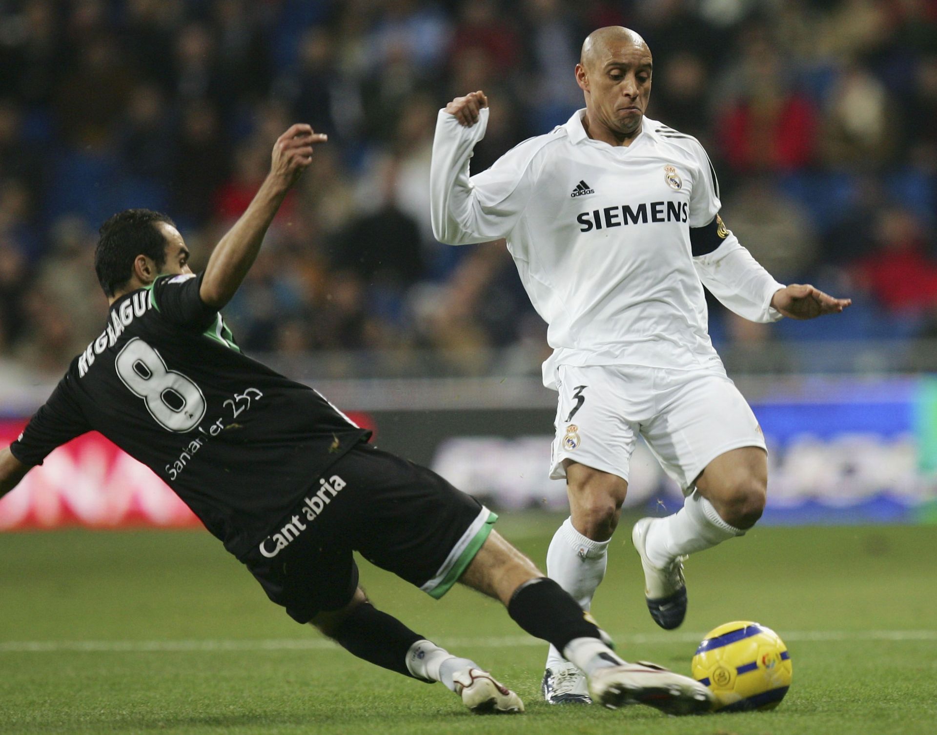 Real Madrid legend Roberto Carlos (right) in La Liga action