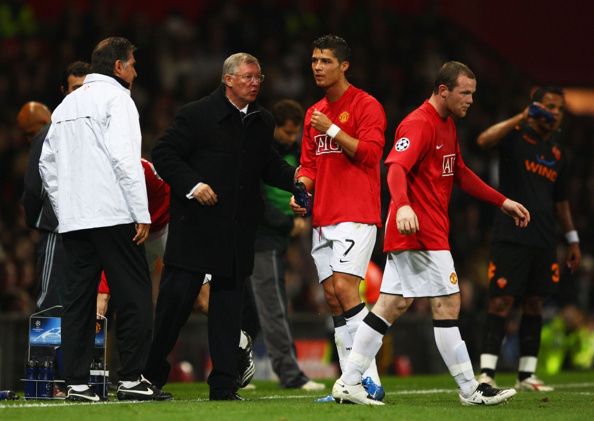 Sir Alex Ferguson with Cristiano Ronaldo and Wayne Rooney during a Champions League game against Roma.