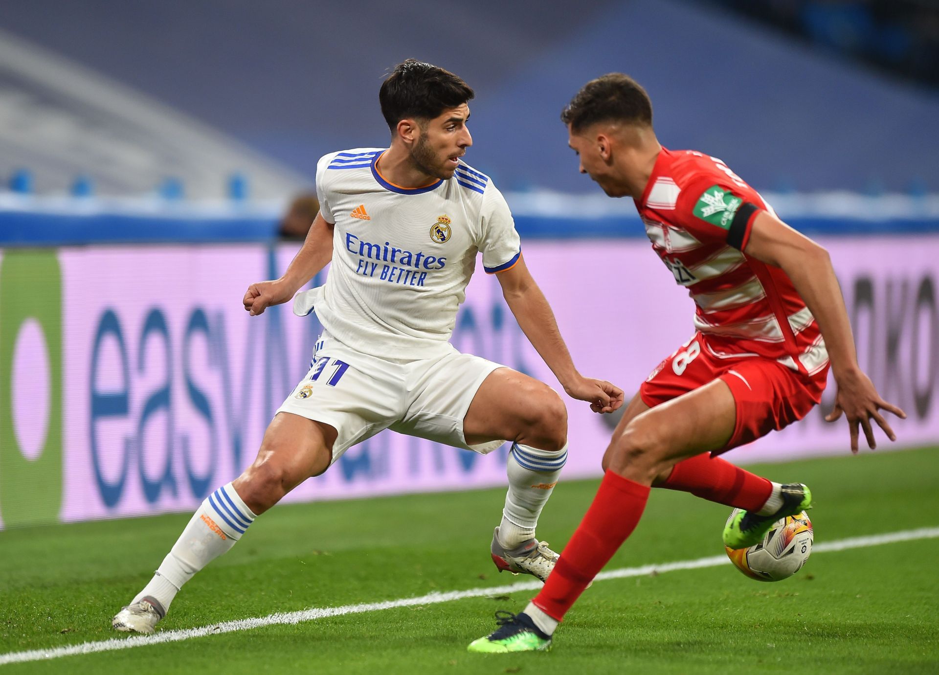 Marco Asensio in action against Granada CF.