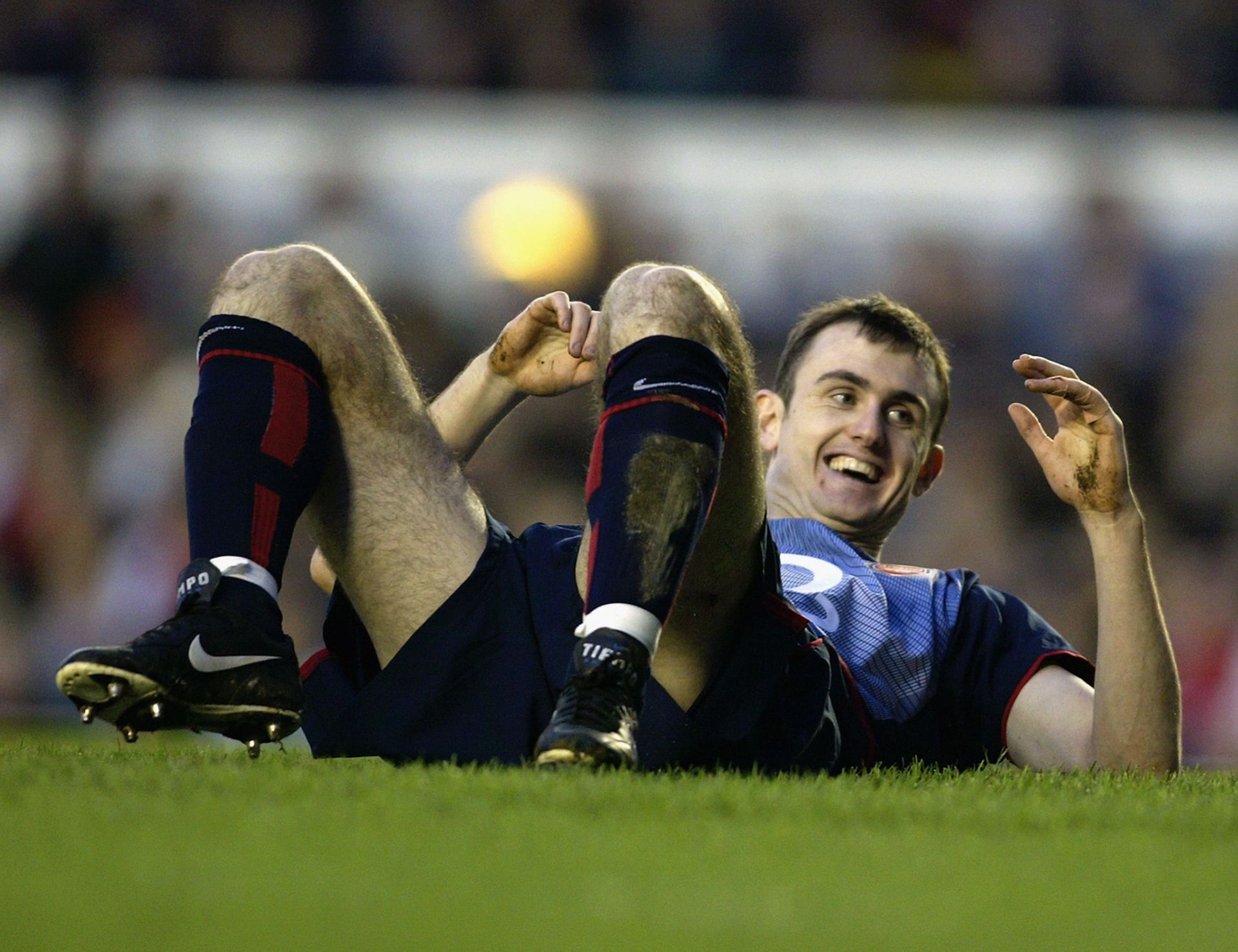 Francis Jeffers laying on the ground laughing