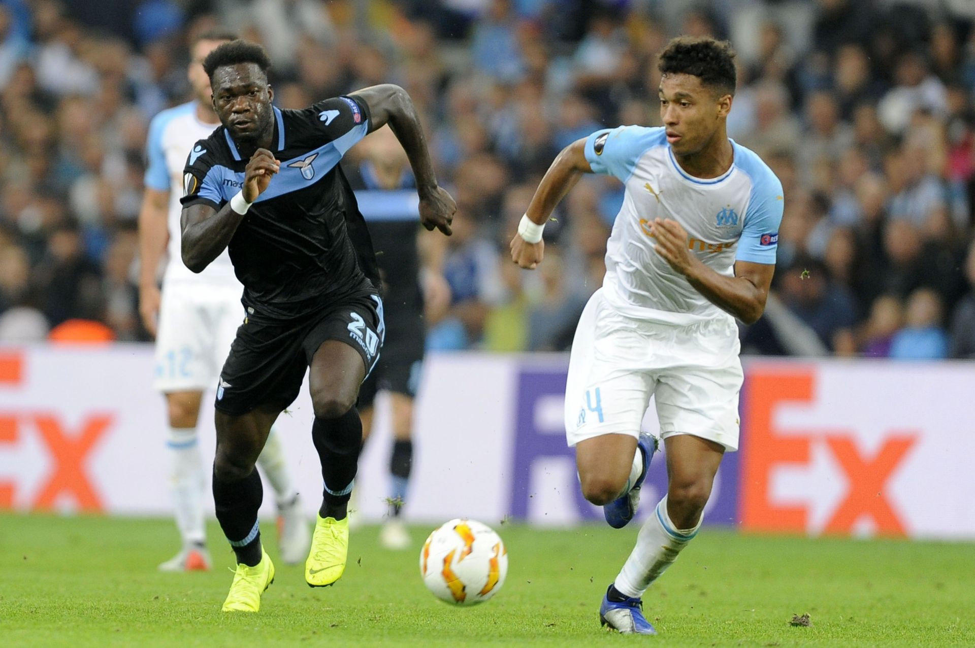 Olympique de Marseille&#039;s Boubacar Kamara (right) gets past Felipe Caicedo of Lazio.