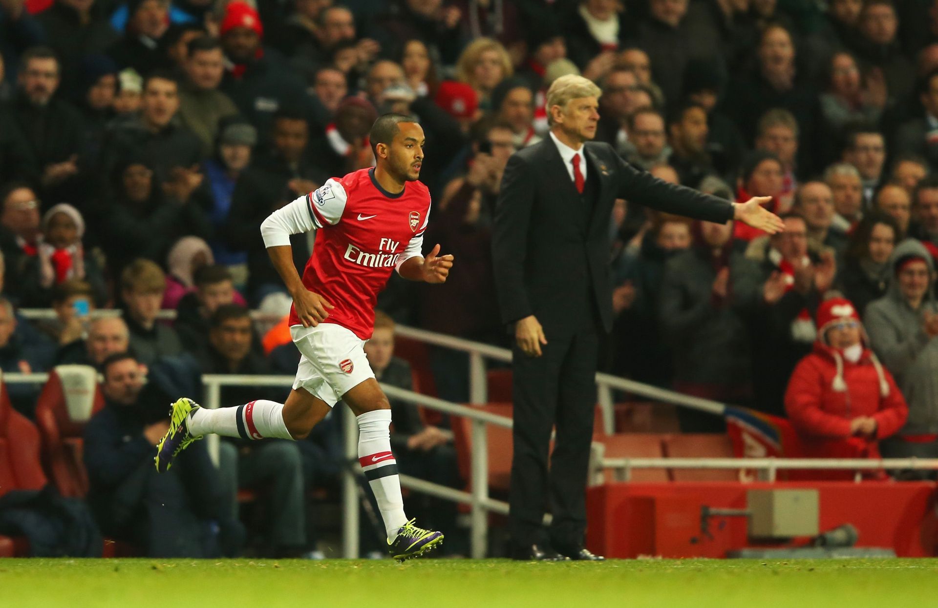 Theo Walcott (left) flourished under Wenger (right).