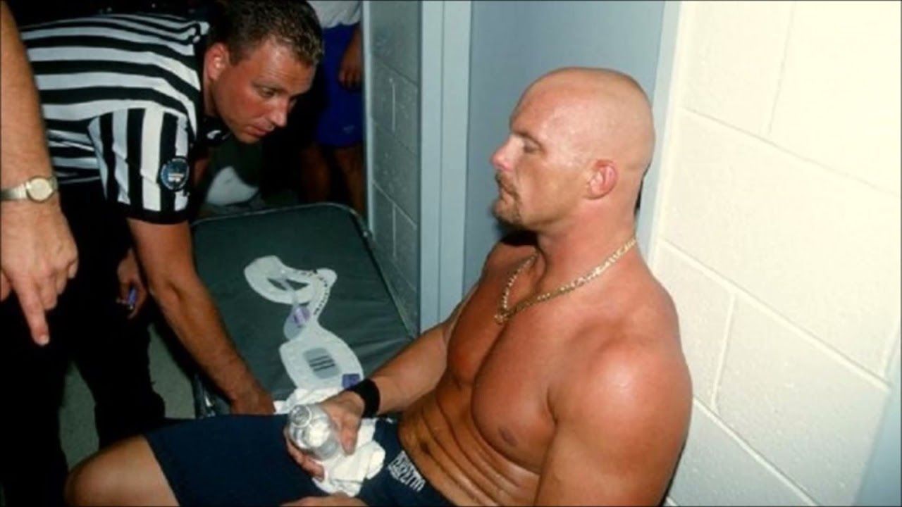 Steve Austin sits backstage after being injured