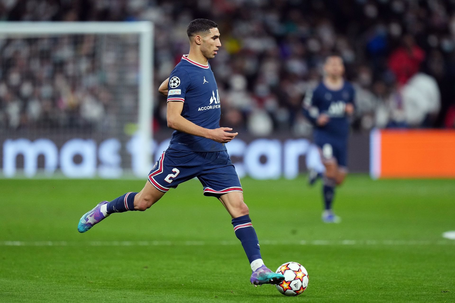 Achraf Hakimi drives forward with the ball.