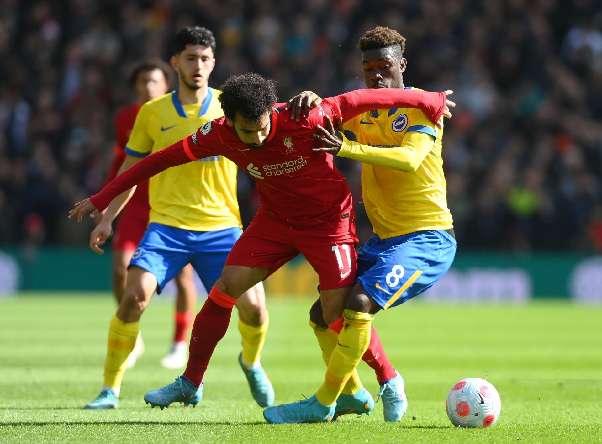 Mohamed Salah tussles it out against Yves Bissouma