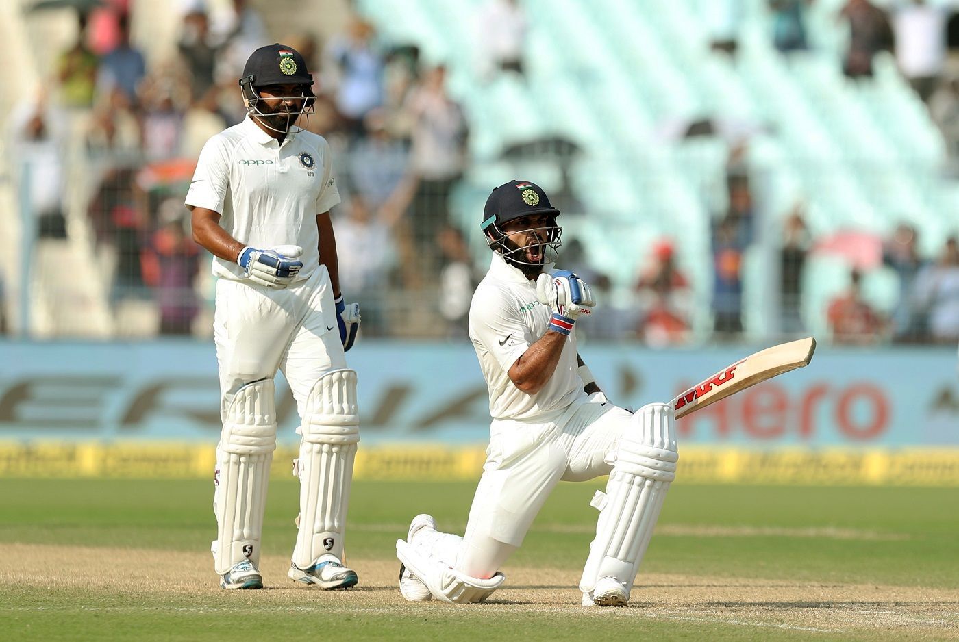 Virat Kohli celebrates after reaching his 50th international ton.