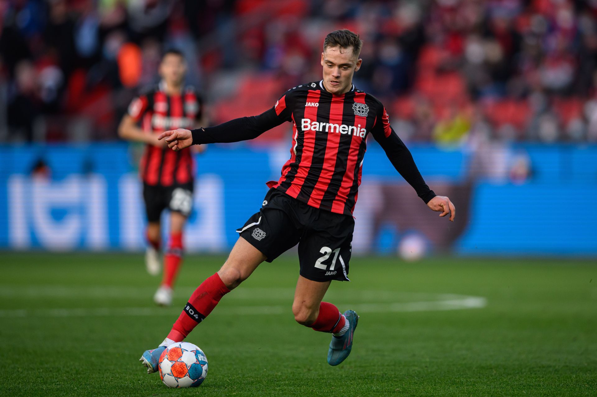 Florian Wirtz controls the ball during a game for Bayer Leverkusen