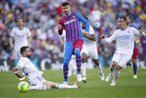 Barcelona defender Gerard Pique (C) in El Clasico action against Real Madrid.