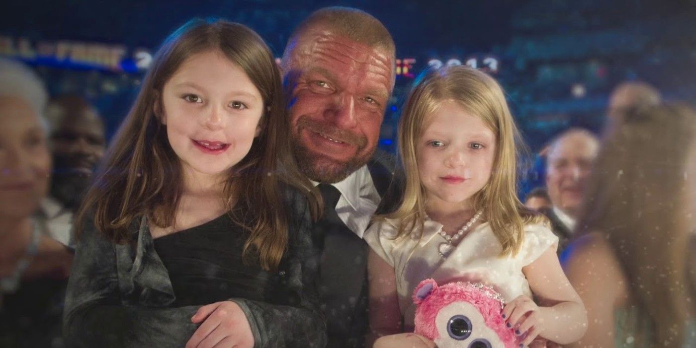 Aurora Rose with her father Triple H and her younger sister Vaughn