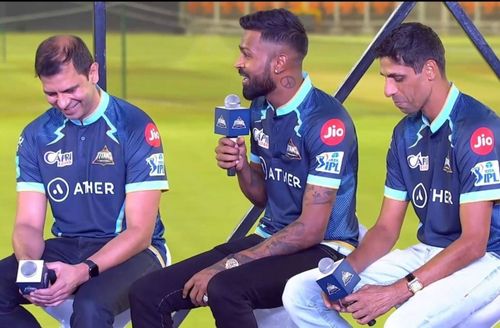 Gujarat Titans skipper Hardik Pandya along with Ashish Nehra and team management members