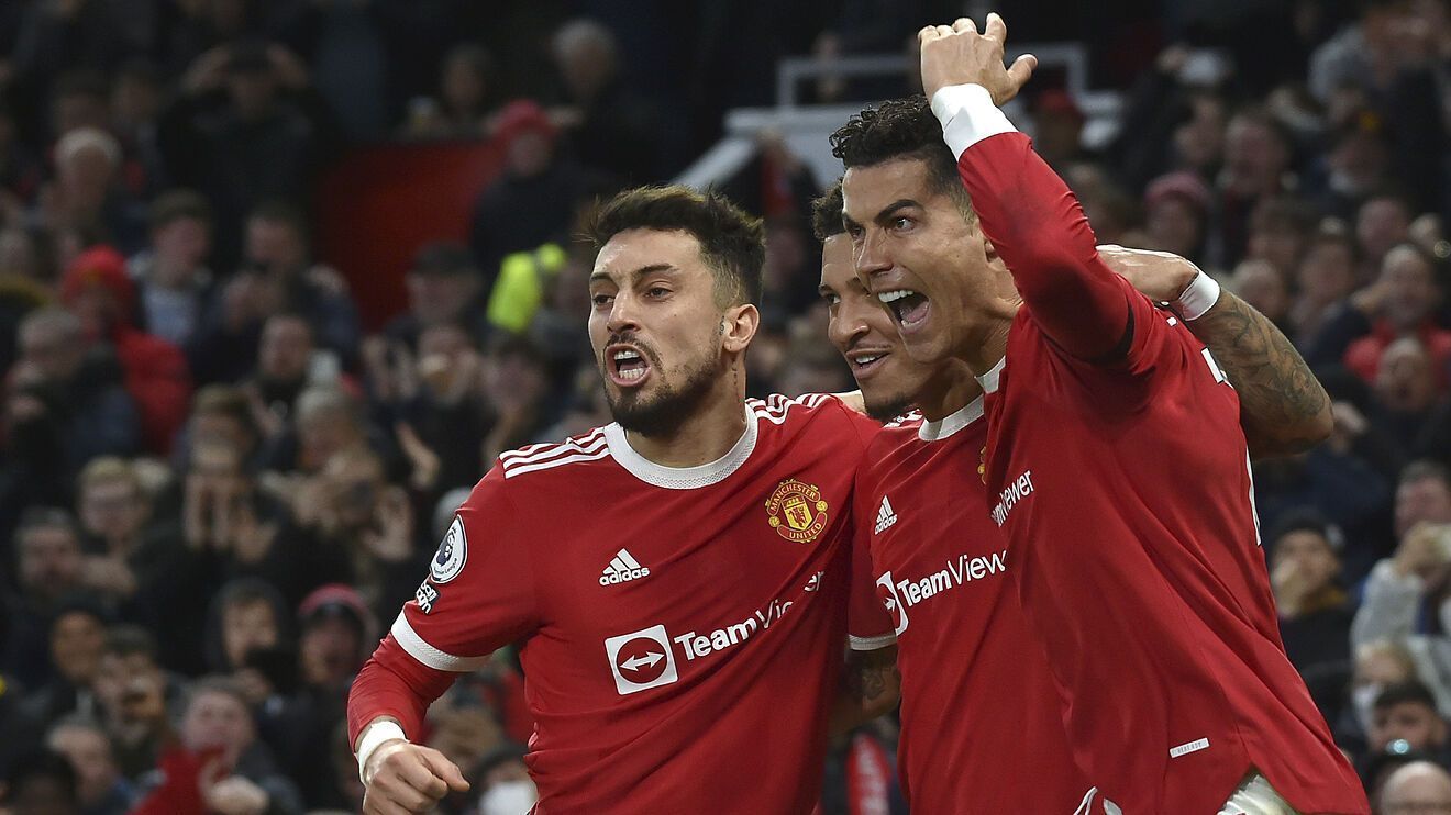 Manchester United players celebrate one of their goals