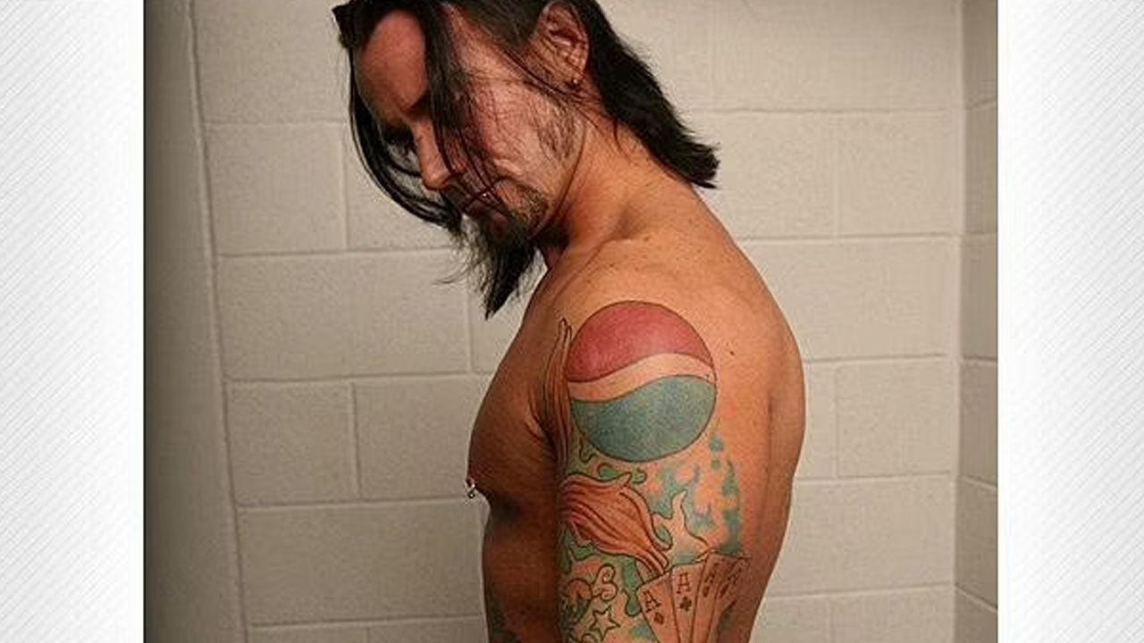 CM Punk's Pepsi tattoo blends incredibly with his other tattoos