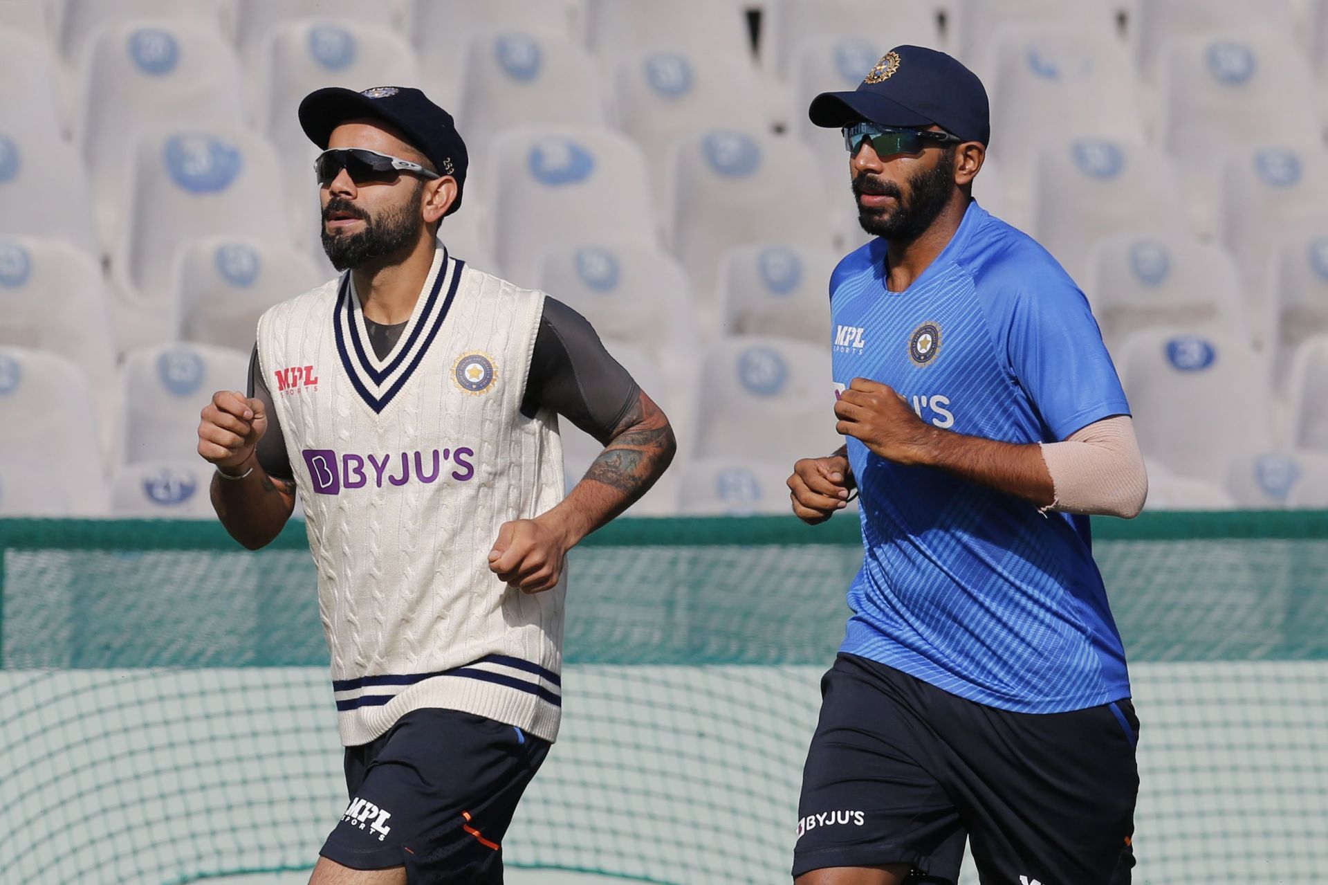 Virat Kohli and Test vice-captain Jasprit Bumrah (R) during a training session in Mohali [Credits: BCCI]