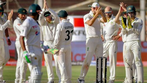 The Australian team applauding Babar Azam for his marathon knock in Karachi. (P.C.: PCB Twitter)