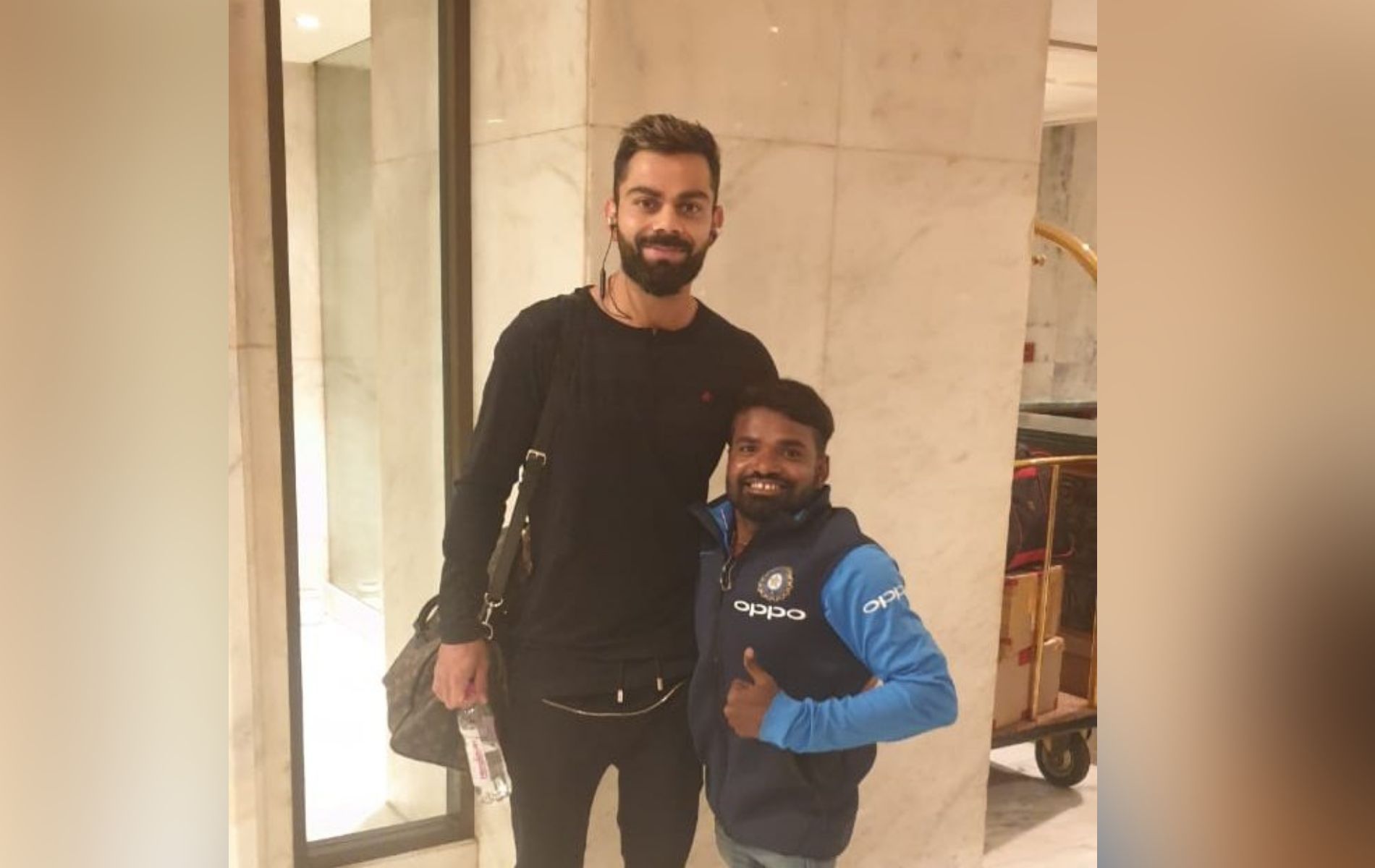 Virat Kohli with the fan he gifted his T-shirt to.