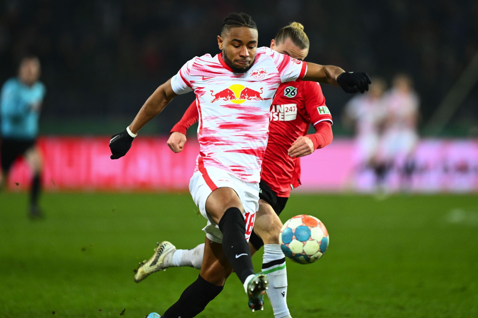 French footballer Nkunku battling for the ball in the DFB Cup quarter final