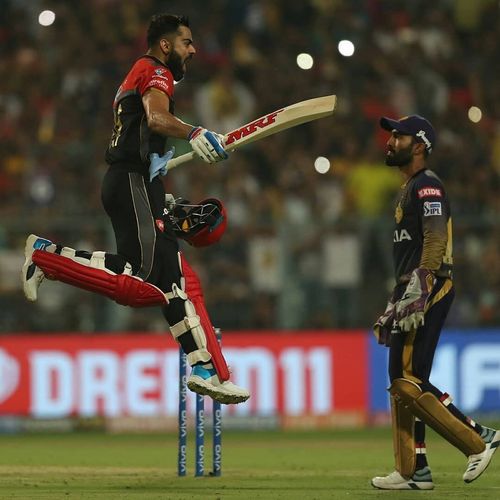 Virat Kohli of Royal Challengers Bangalore celebrates as Dinesh Karthik watches [PLT20]