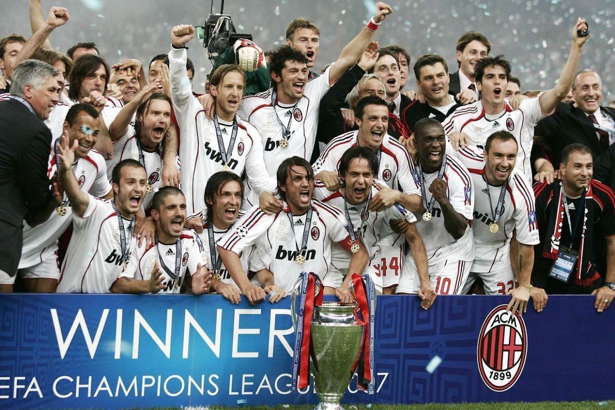 Milan players celebrating their Champions League truimph. Milan players celebrating a goal.