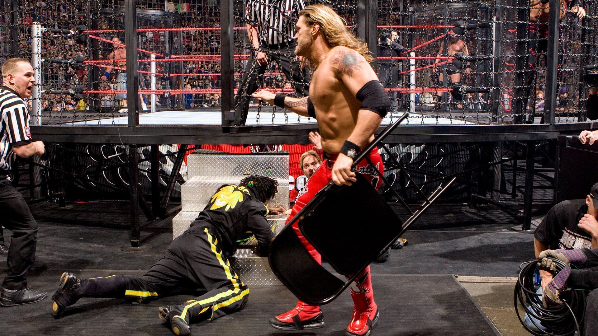 Edge attacking Kofi Kingston