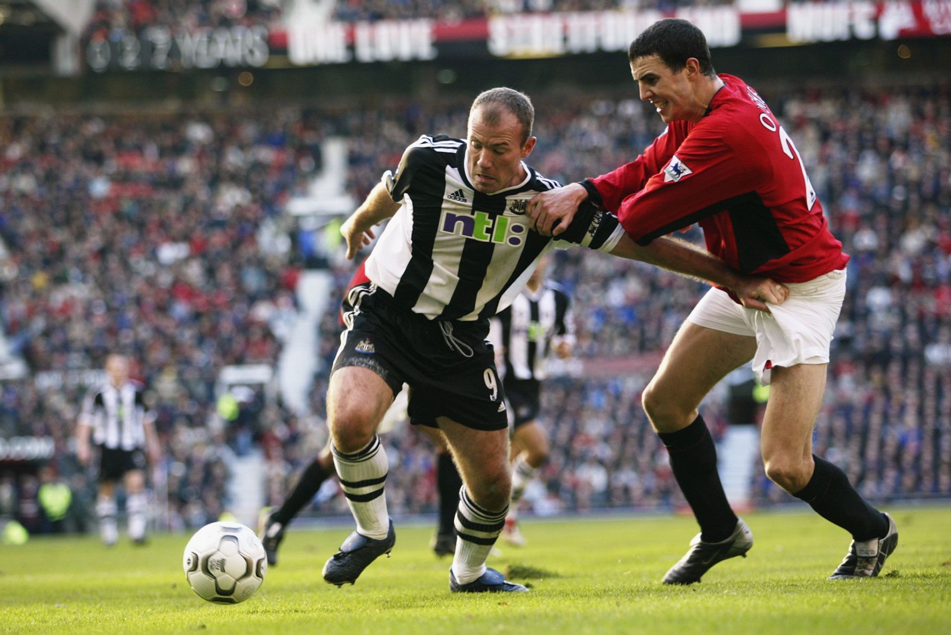 John O'Shea of Manchester United and Alan Shearer of Newcastle United