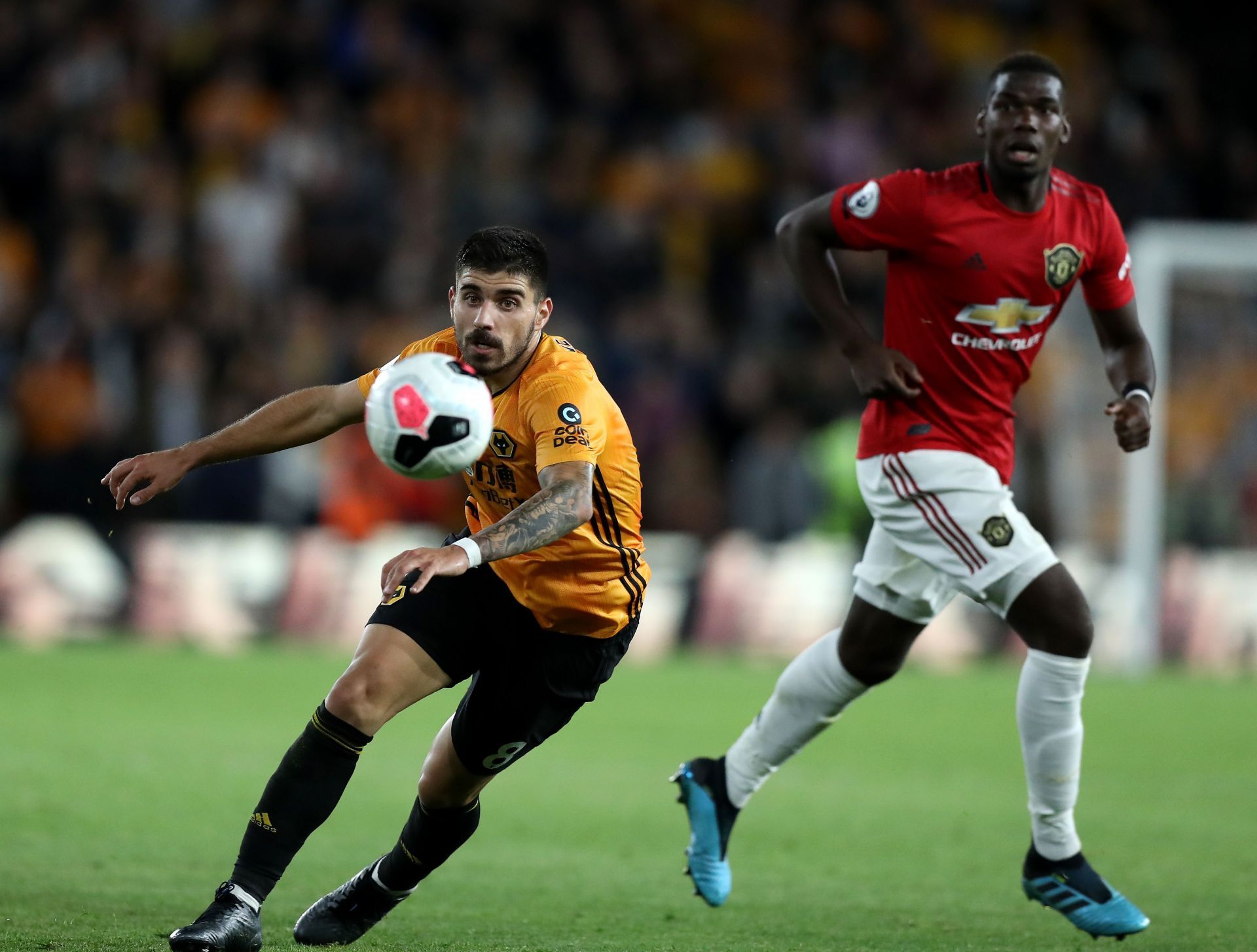 Wolves&#039; Ruben Neves (L) in action against Paul Pogba.