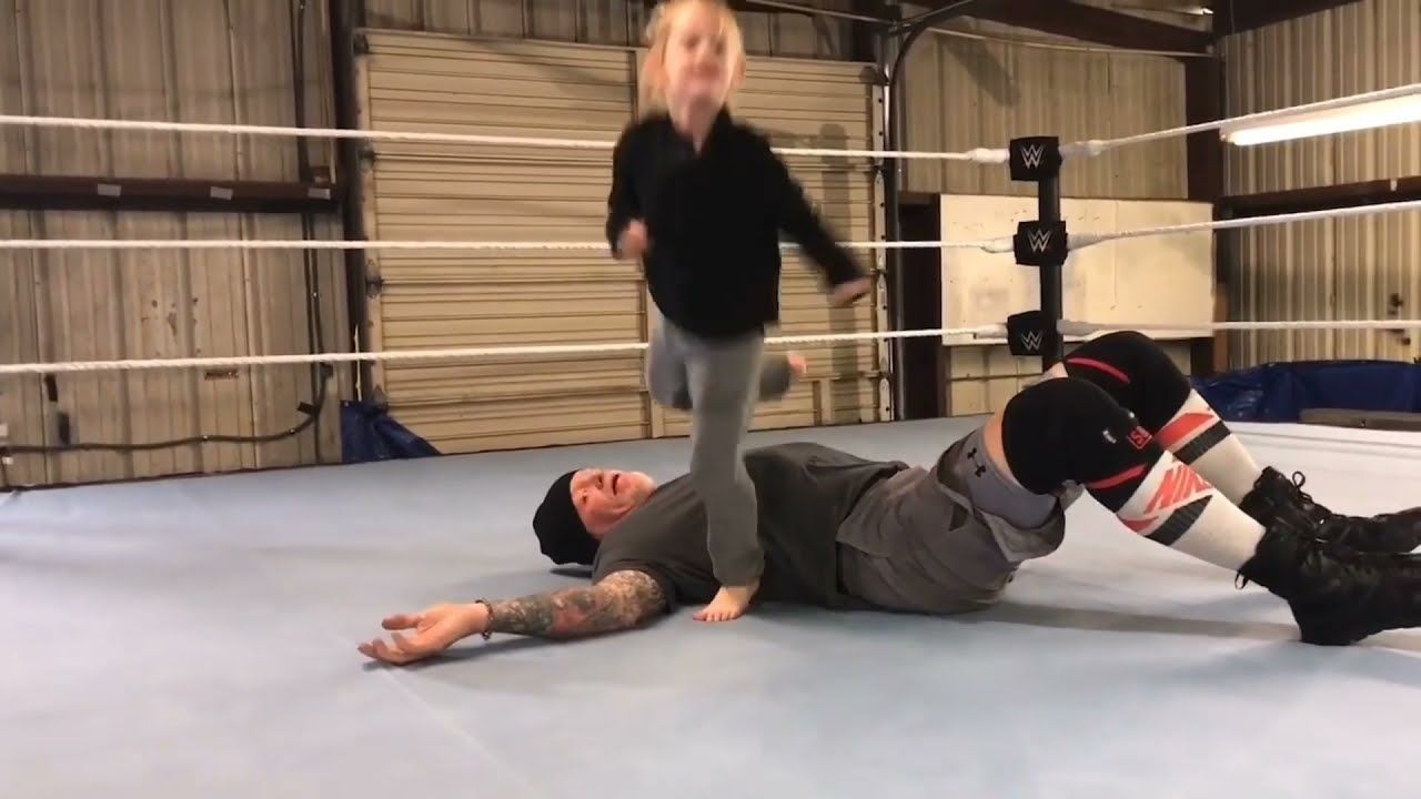 The Undertaker in the ring with his daughter Kaia