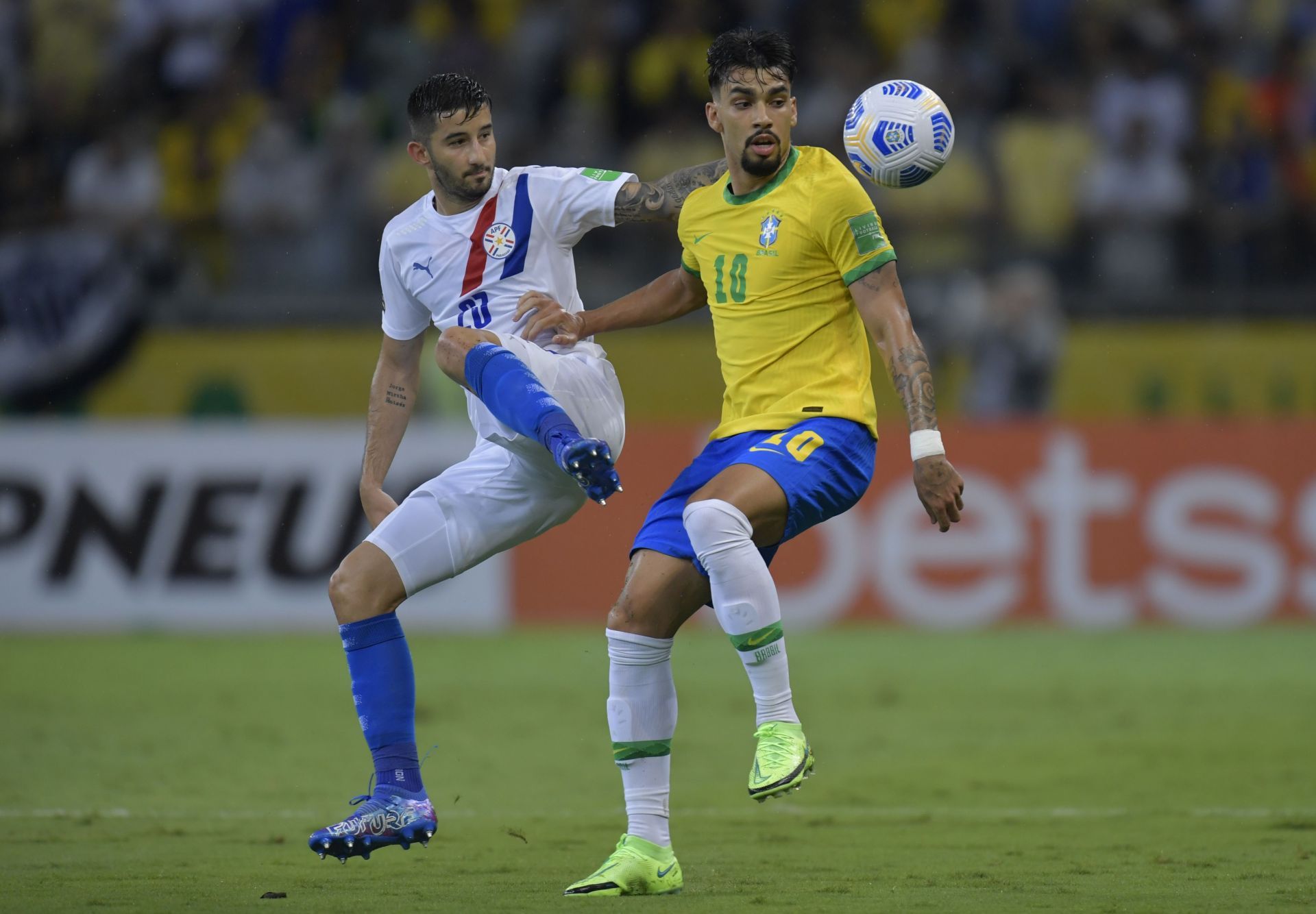 Lucas Paqueta (R) in action for the Brazilian national team.