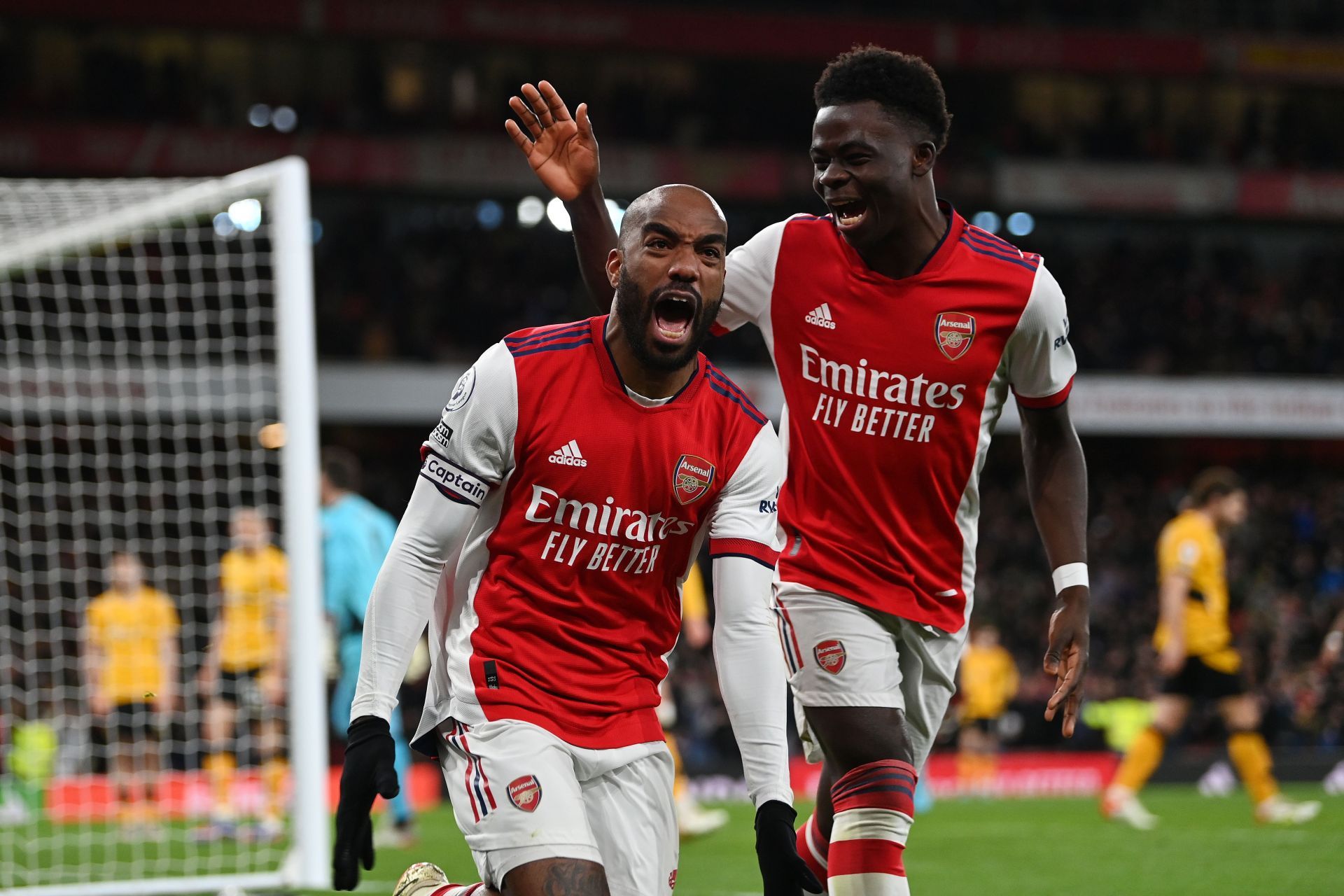 Despite the lack of striking options, Alexandre Lacazette (L) and Bukayo Saka (R) have delivered the goods for Arsenal this season.