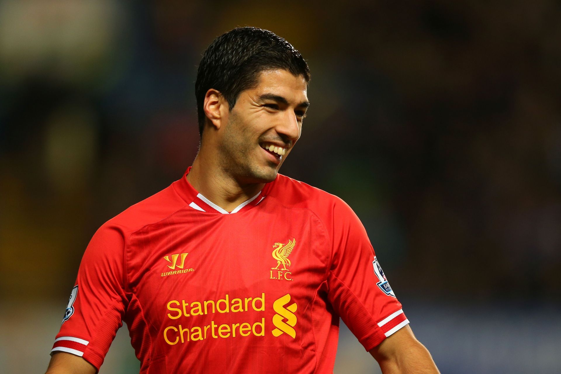 Luis Suarez smiles in Chelsea v Liverpool