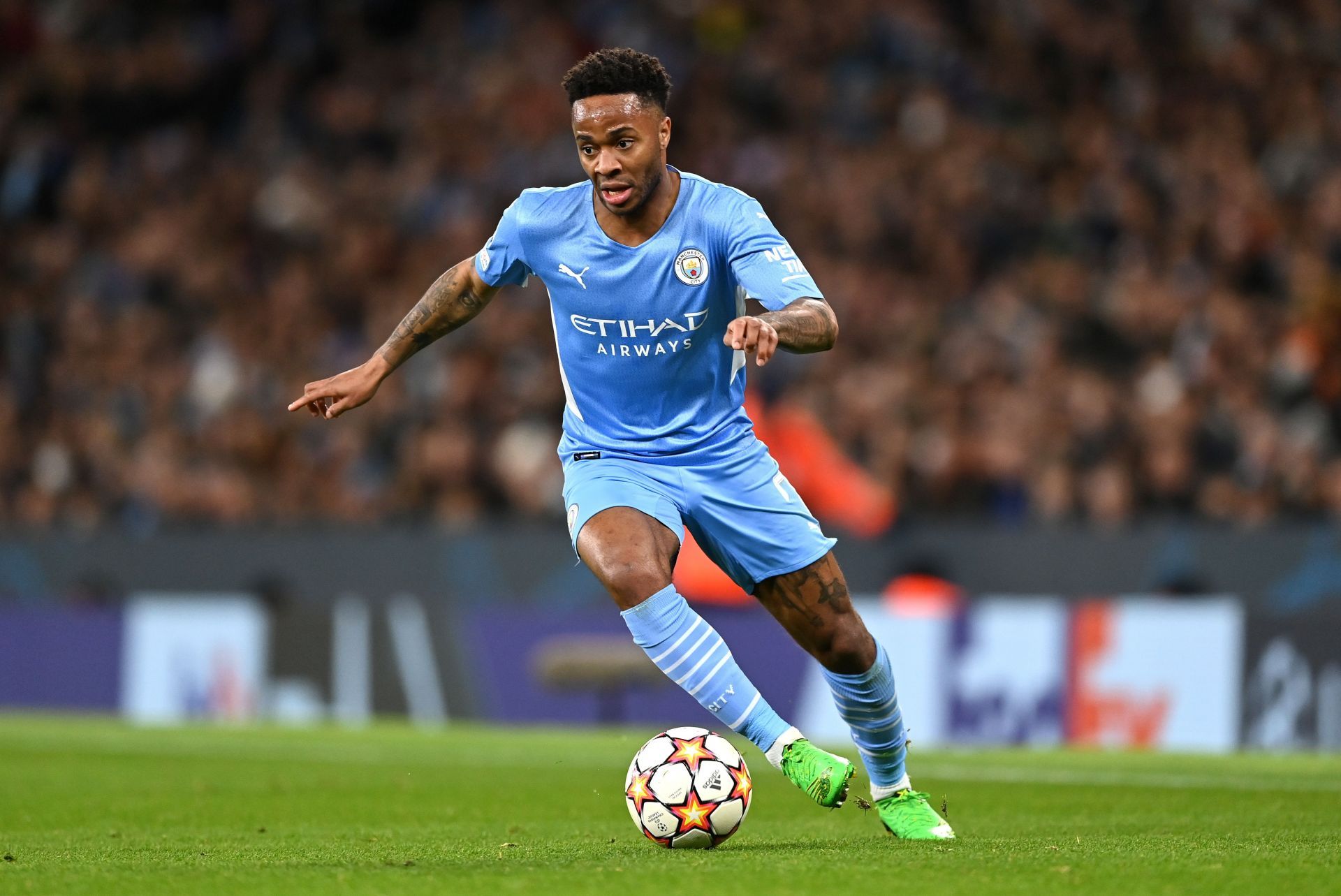 Manchester City&#039;s Raheem Sterling drives at the Sporting Lisbon defense