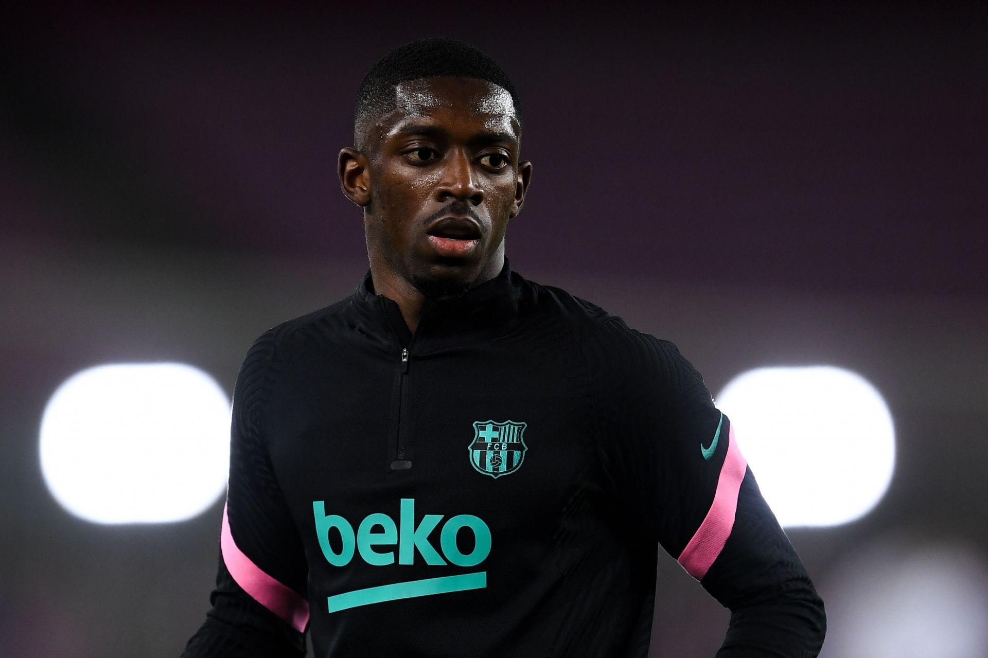 Ousmane Dembele warms up for Barcelona.