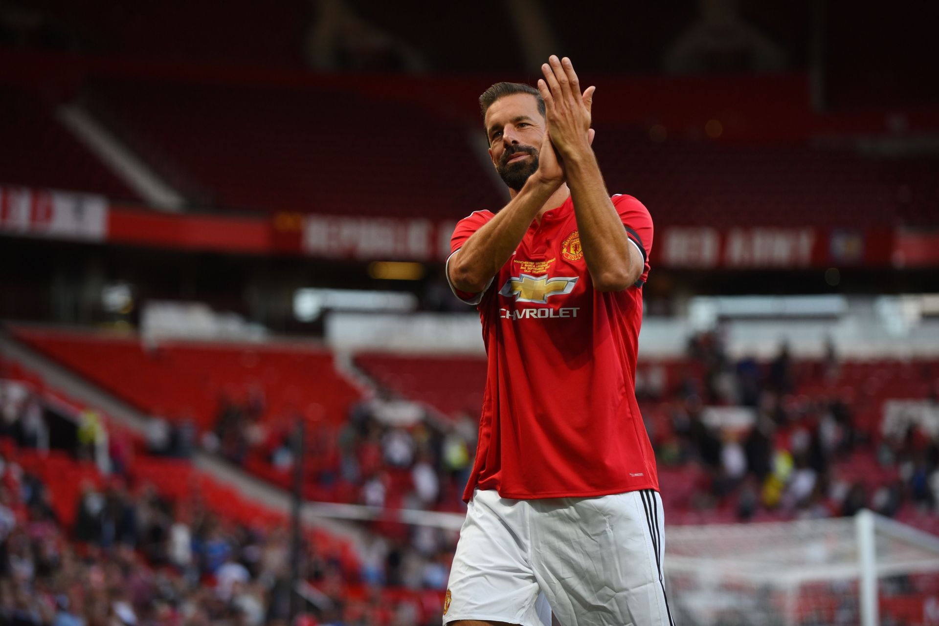 Ruud van Nistelrooy applauds the Old Trafford crowd.